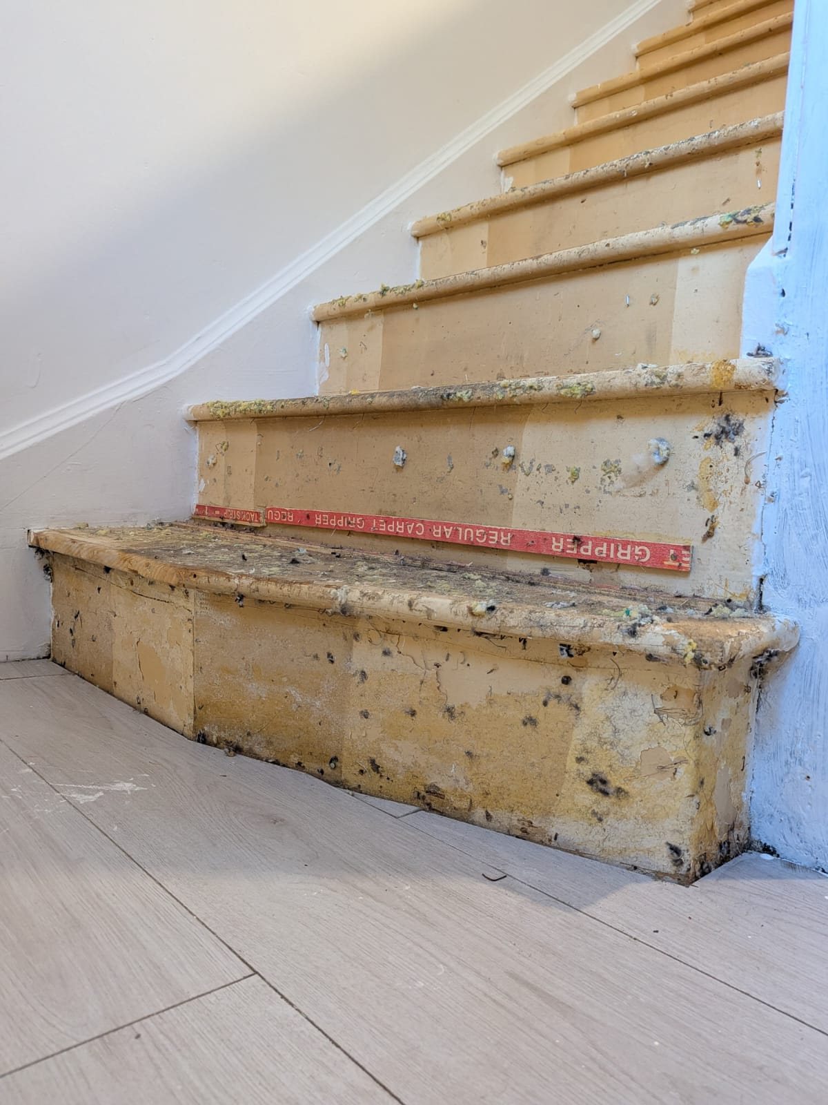 Bottom step, stripped back and rebuilt, before